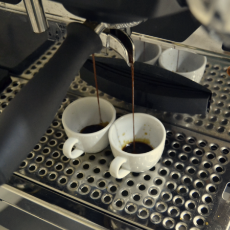 Espresso pour into coffee cups
