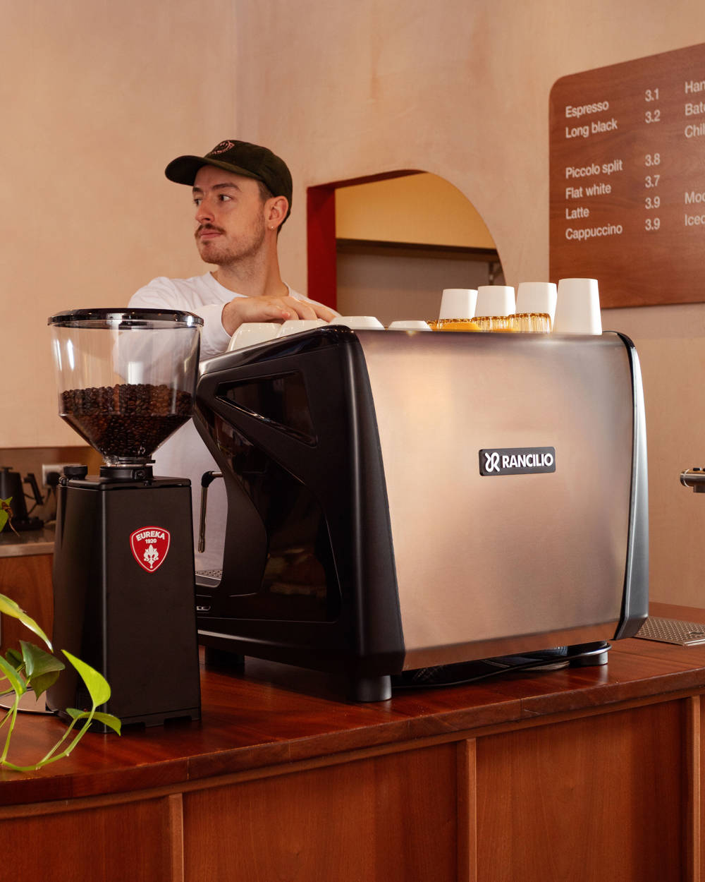 Barista Using 2 Group Rancilio Espresso Machine 