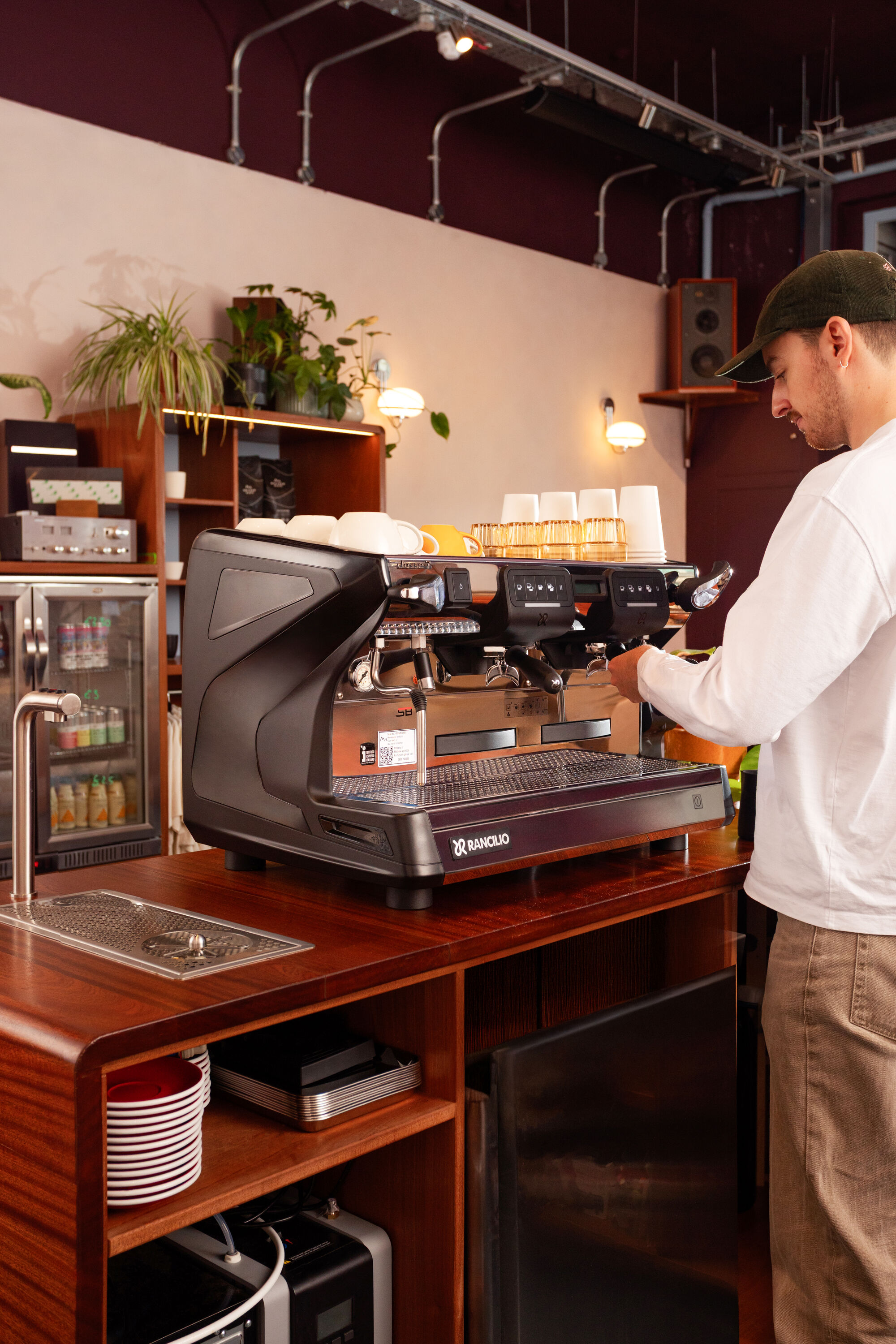 Barista Using Rancilio Coffee Machine 